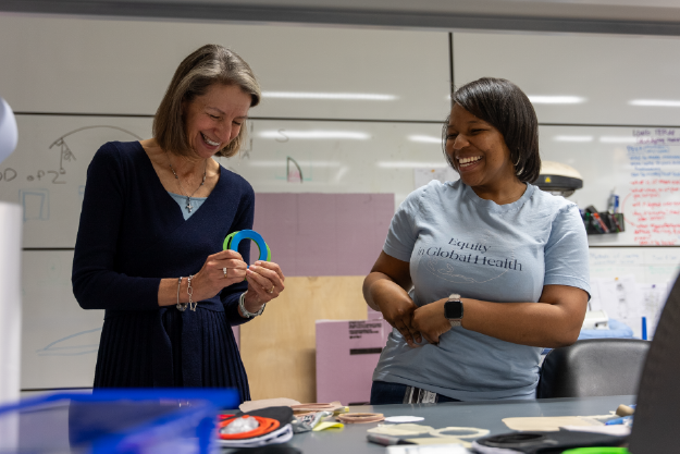 photo of rebecca richards-kortum and engineer breanna kilgore working on colostomy prototype